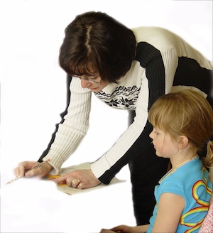 Teacher helping a child