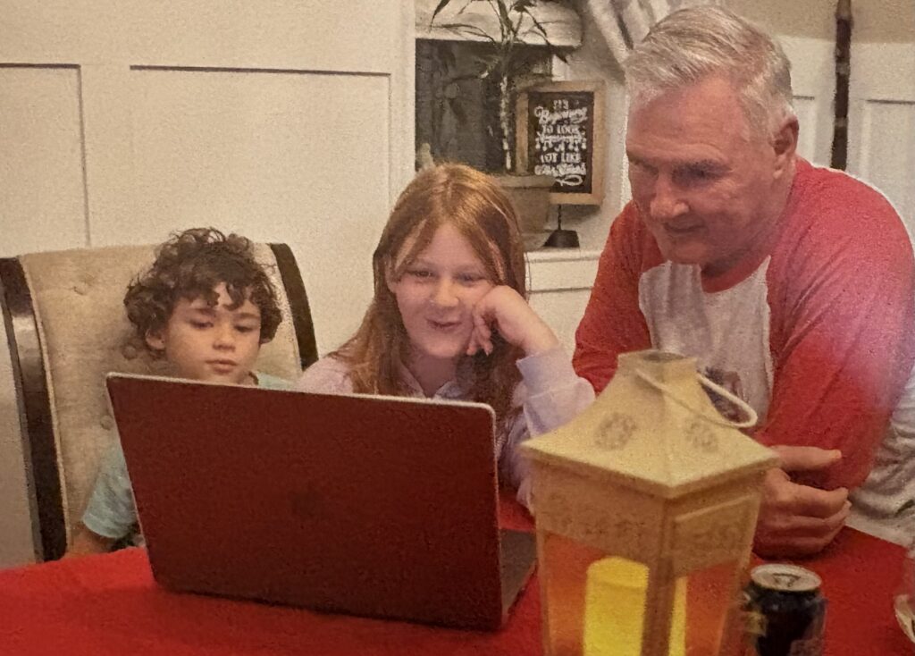Julia with her brother and Pops working on her book.
